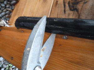 Cut a small section of irrigation pipe, about two inches. Then cut about 1/4" strip lengthwise.