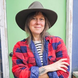 Renee Wilkinson in front of a green garden door